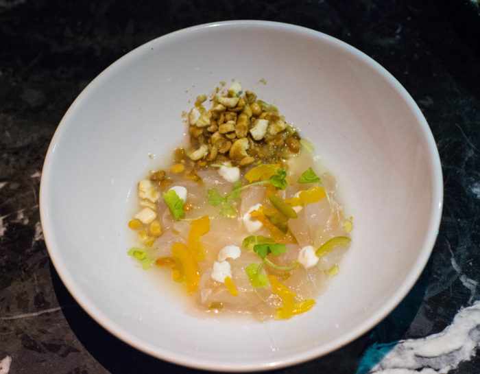 Le Turtle Black Bass Crudo, gazpacho broth, almond curd, celery leaf & soy nut crumble - $16