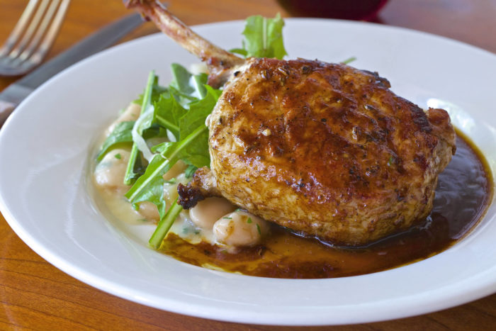 the little owl pork Pork Chop & Butter Beans, parmesan, wild dandelion - $33