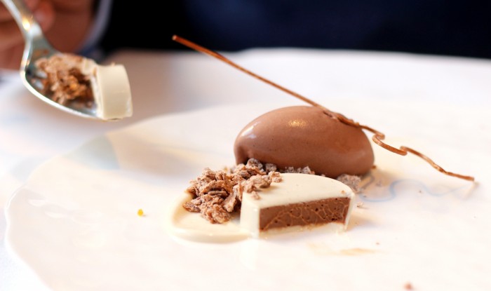 A bite of Gianduja Crémeux - wafer streusel and Nutella ice cream