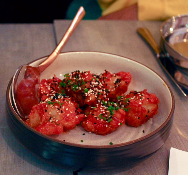 Colonel Tso's Cauliflower - Indo-Chinese style cauliflower in a tomato chili sauce, sesame and onion seed, chives