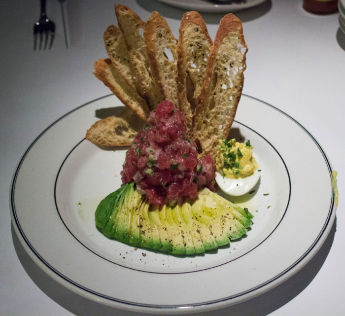 EastHamptonGrill TUNA TARTARE sushi grade tuna hand chopped, avocado and a deviled egg ($27)