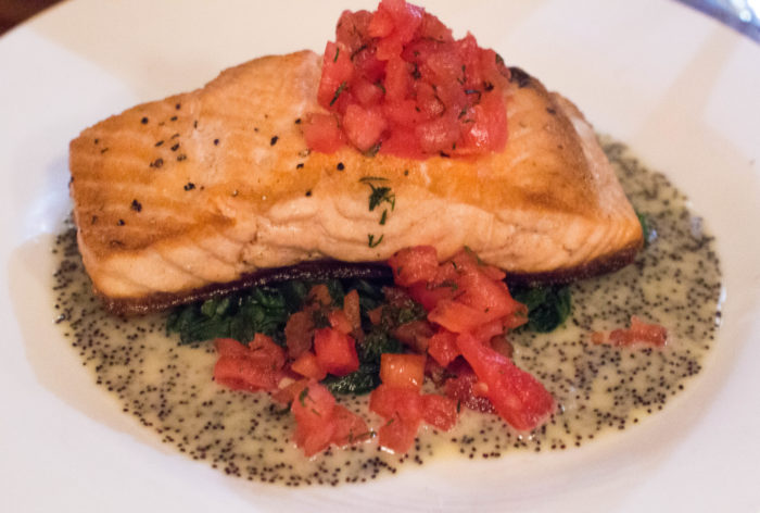 Pan Roasted Salmon, tomato concasse, sesame poppyseed dressing, spinach ($17)