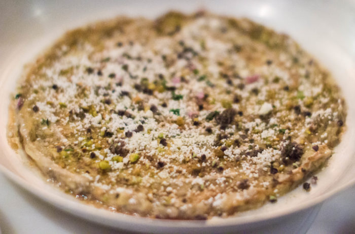 Nur Smoked Eggplant Carpaccio, fire roasted with feta, raw tahini, dates, pistachios, rose water ($22)