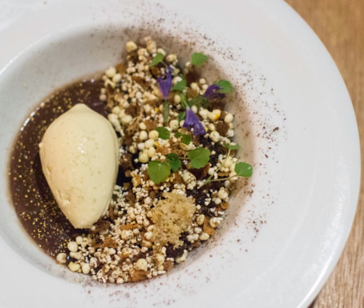 Smoked Chocolate Custard dessert, puffed grain granola, cherries, figs, sambuca flowers, salted pretzel ice cream ($16) nur nyc