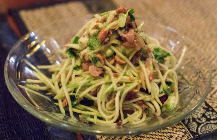 Yum Mamoung - Green Mango Salad, avocado, cripsy dried squid, crushed peanut, chilim lime (available Vegetarian) $14